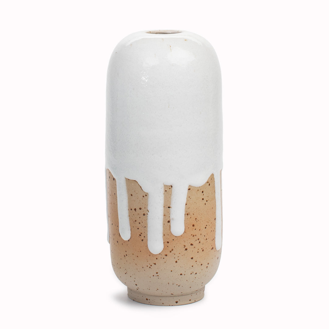 The heavily glazed Thick Milk design is hand-thrown in watertight stoneware. Due to the rounded taper at the top of the vase, the glaze melts down the sides of the cylindrical vase mimicking melting ice.&nbsp;