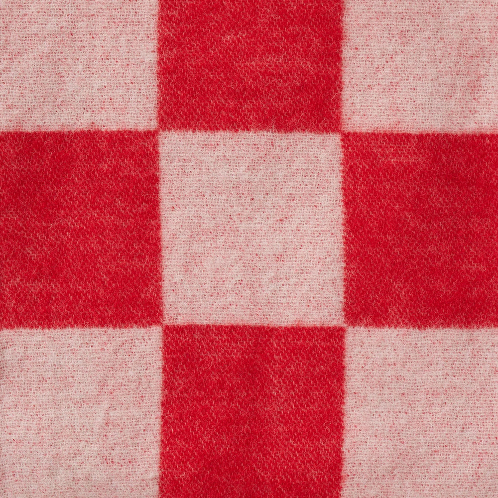 The Tile throw from Klippan offers a blend of traditional craftsmanship and modern design, perfect for adding a touch of warmth and elegance to any room.