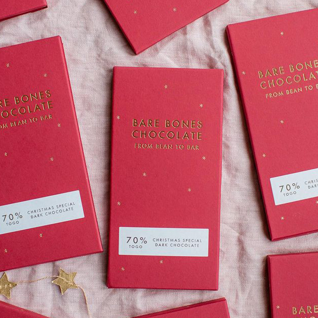 The 2024 Christmas Special chocolate bar by Bare Bones is a single-origin Togo 70% dark chocolate with appropriately festive taste notes of yule log and red berries.