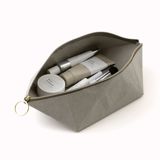 The tray pouch from, Midori Japan, is a desktop accessory holder made from a durable coated paper. The paper is lightweight, strong and tear resistant but also soft to the touch and will soften slightly over time.