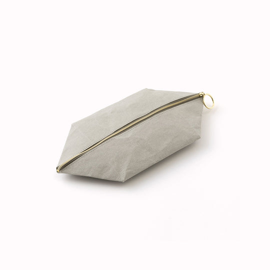 The tray pouch from, Midori Japan, is a desktop accessory holder made from a durable coated paper. The paper is lightweight, strong and tear resistant but also soft to the touch and will soften slightly over time.