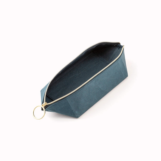 The tray pouch from, Midori Japan, is a desktop accessory holder made from a durable coated paper. The paper is lightweight, strong and tear resistant but also soft to the touch and will soften slightly over time