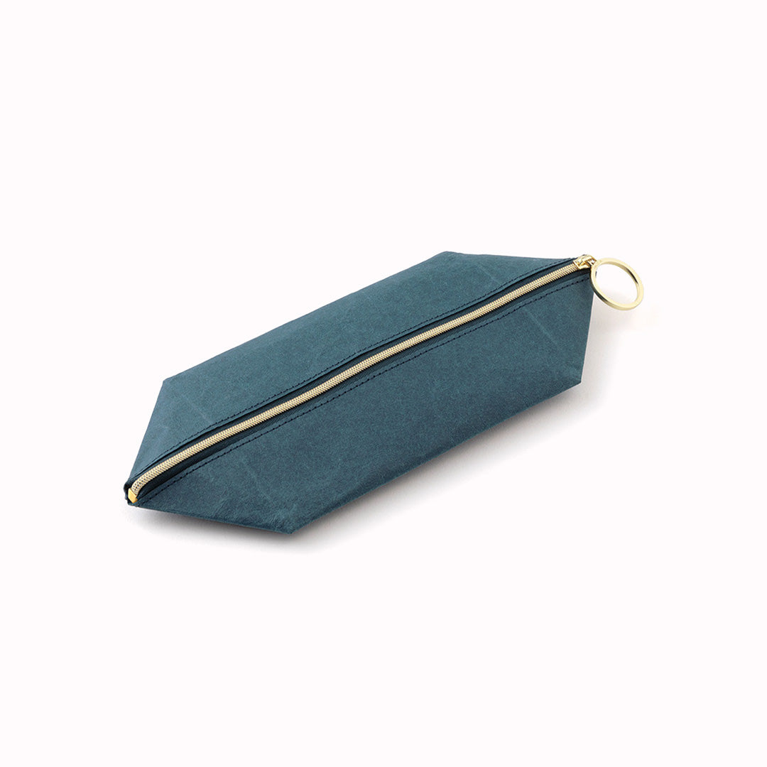 The tray pouch from, Midori Japan, is a desktop accessory holder made from a durable coated paper. The paper is lightweight, strong and tear resistant but also soft to the touch and will soften slightly over time