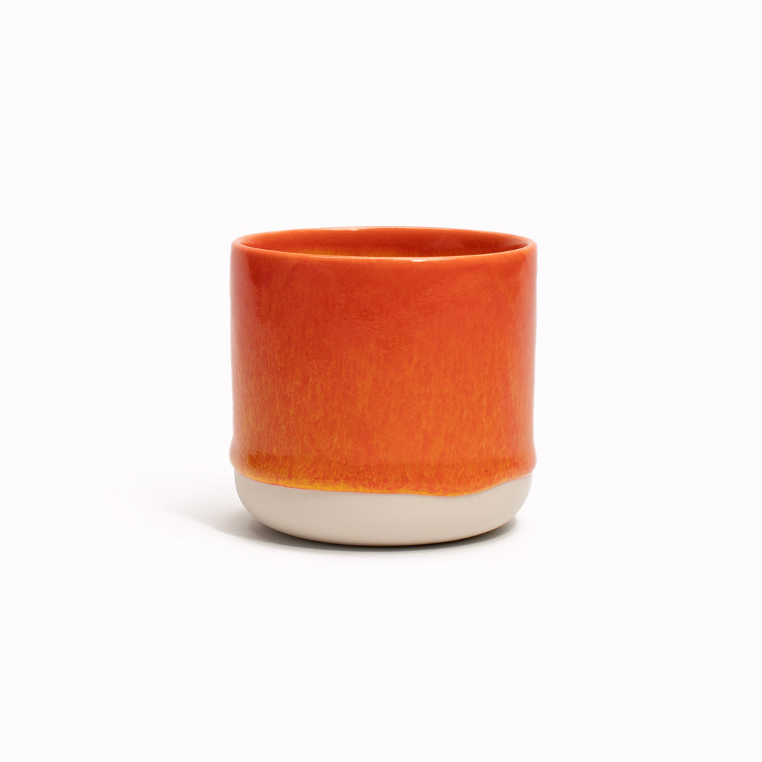 The yellow rimmed, pink drip glazed Quench Cup is handmade in Denmark - meaning glaze colour and finish will never be exactly the same on any two items, but this is absolutely a part of their unique appeal.