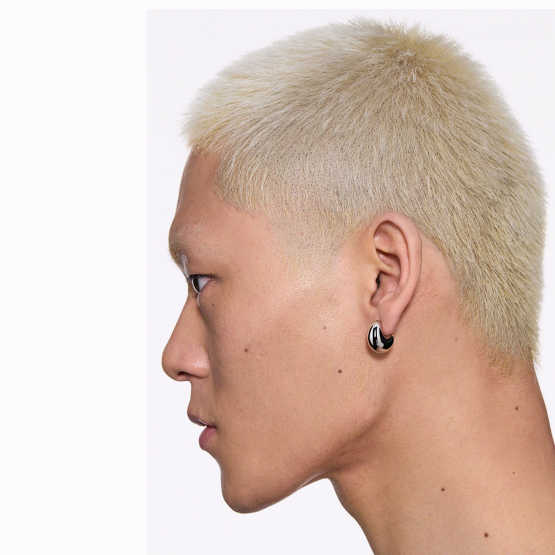The Tryvann Pillow earring is designed in Denmark and skilfully crafted in 925 recycled sterling silver and plated with either White Rhodium or 18ct Gold, It is a chunky half-hoop earring that is Nickel free and hypoallergenic.