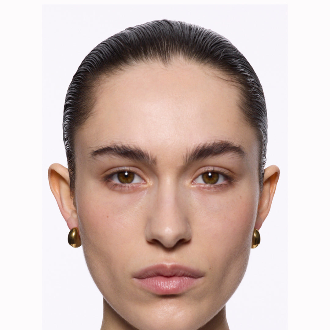 The Tryvann Pillow earring is designed in Denmark and skilfully crafted in 925 recycled sterling silver and plated with either White Rhodium or 18ct Gold, It is a chunky half-hoop earring that is Nickel free and hypoallergenic.