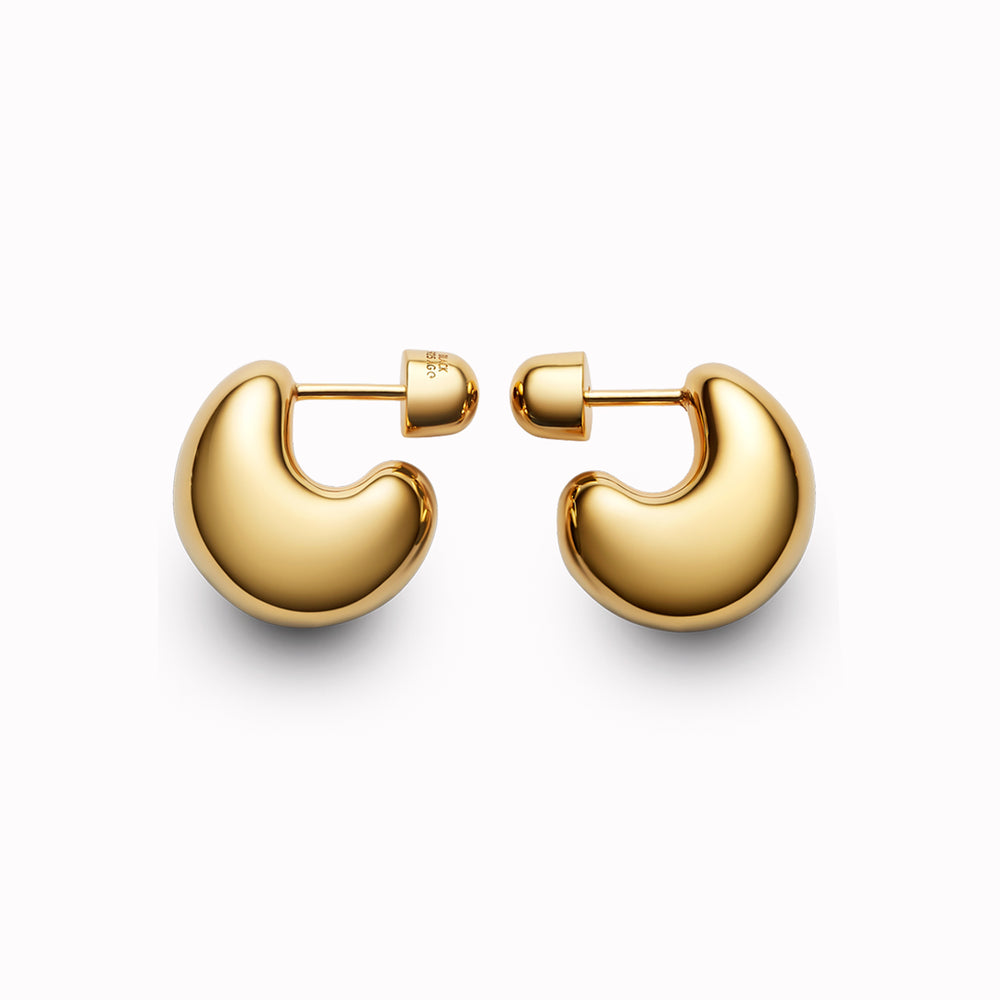 The Tryvann Pillow earring is designed in Denmark and skilfully crafted in 925 recycled sterling silver and plated with either White Rhodium or 18ct Gold, It is a chunky half-hoop earring that is Nickel free and hypoallergenic.