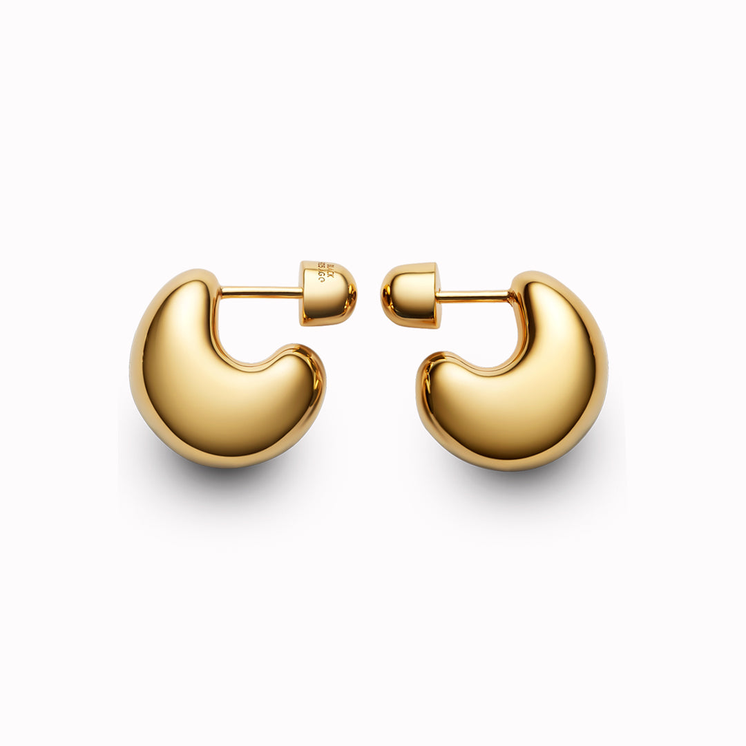 The Tryvann Pillow earring is designed in Denmark and skilfully crafted in 925 recycled sterling silver and plated with either White Rhodium or 18ct Gold, It is a chunky half-hoop earring that is Nickel free and hypoallergenic.