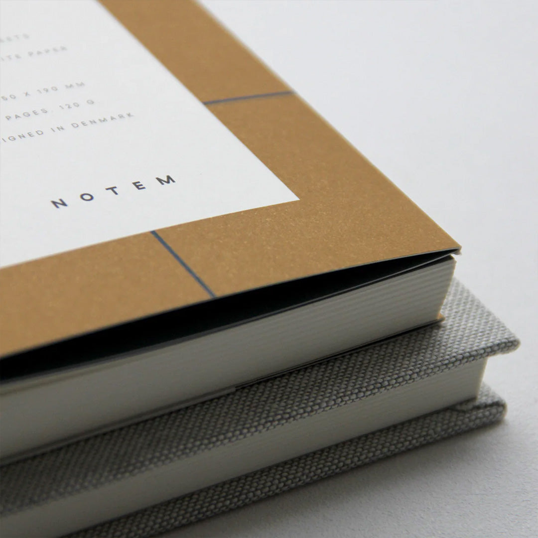 The Notem Uma Layflat Notebook is a sleek and elegant notebook that features a soft cover and a layflat binding. The notebook has 160 pages of high-quality paper that are perfect for writing, sketching, or journaling. 