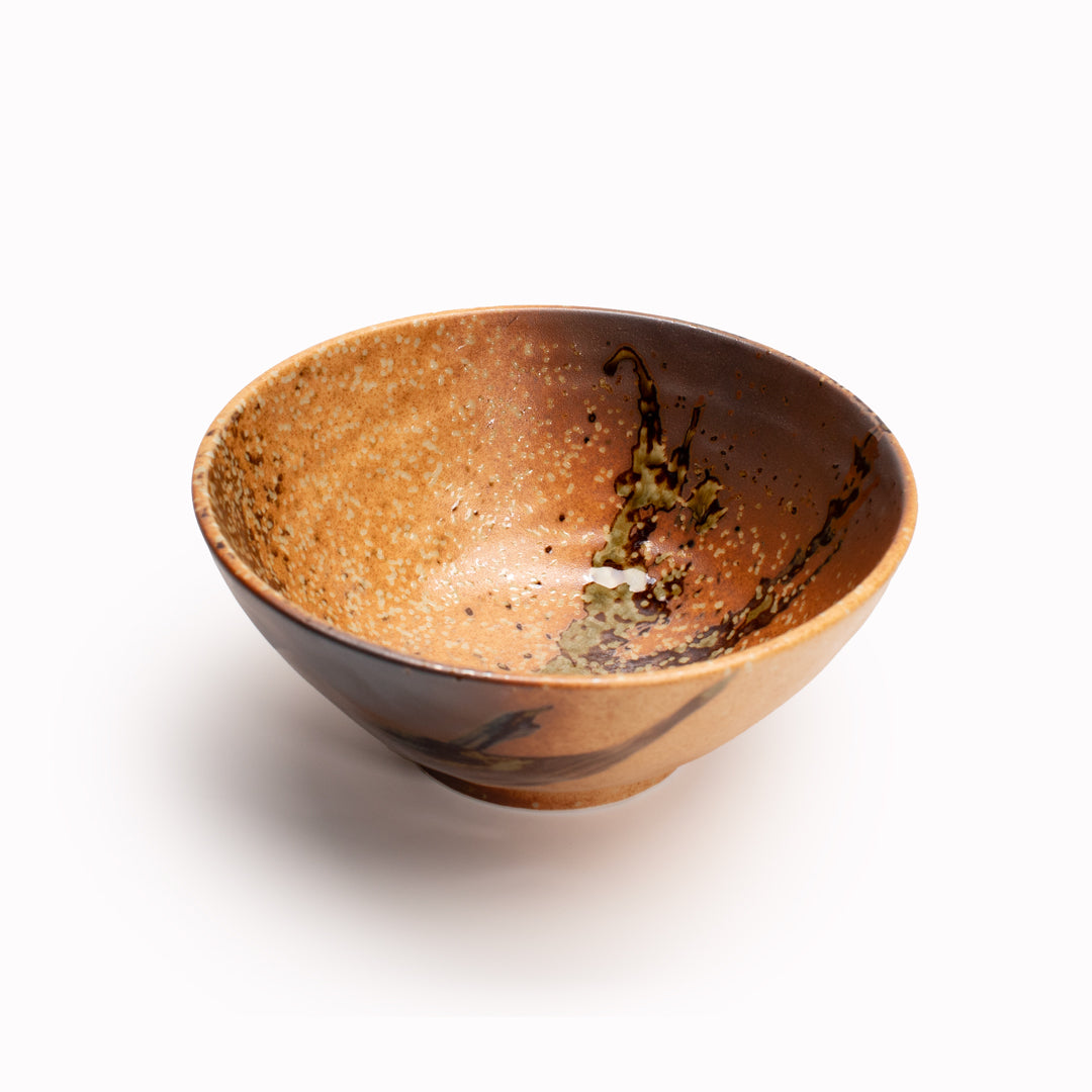 Shallow terracotta Udon bowl from Made in Japan,  featuring a rustic glaze with striking green splash. Perfect for Noodles. viewed from above.