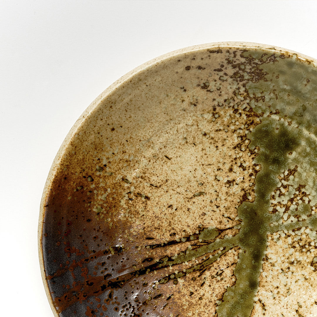 Shallow terracotta Udon bowl from Made in Japan,  featuring a rustic glaze with striking green splash. Perfect for Noodles. Detail View