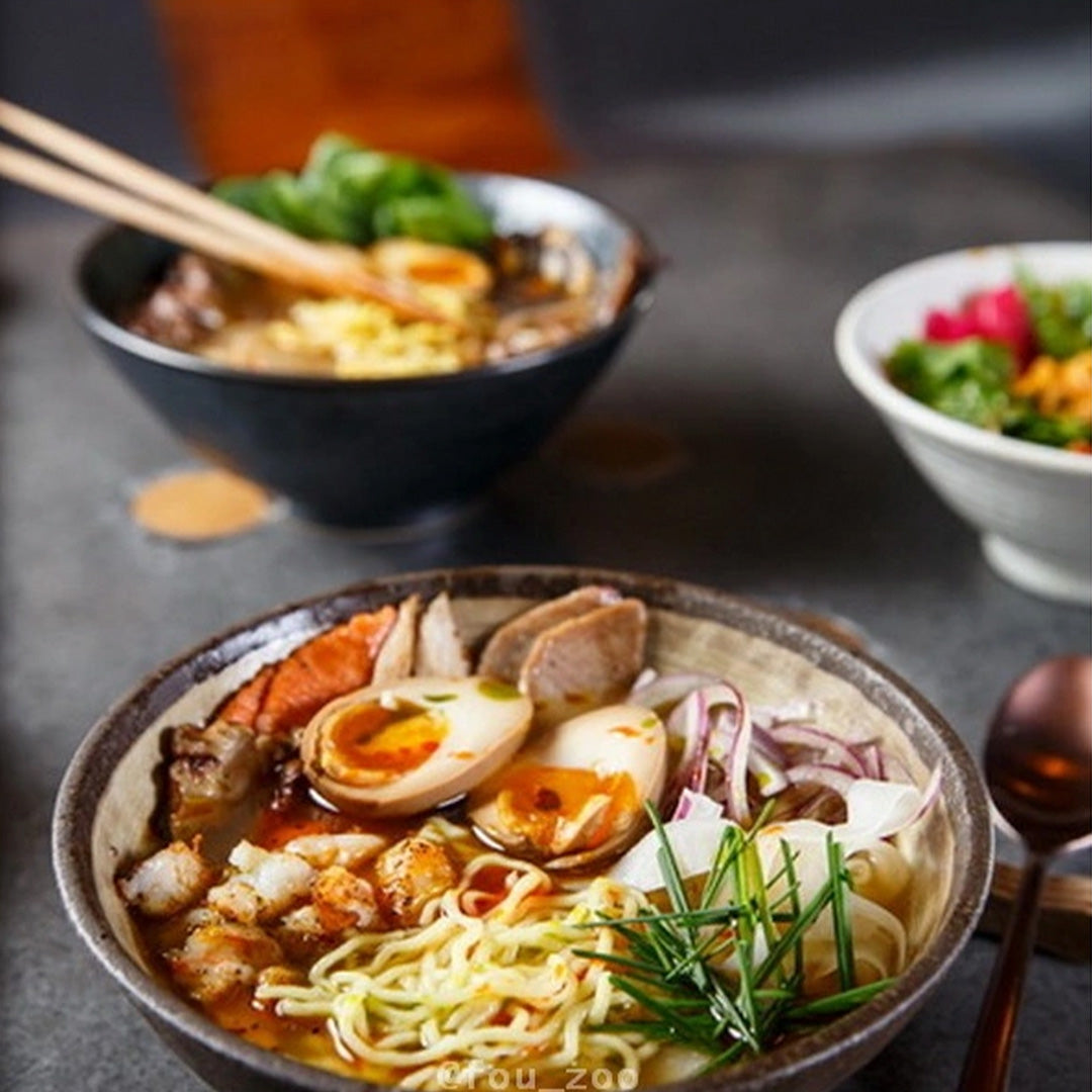 Stunning Udon bowl from Made in Japan with featuring earthy brown glaze with a circular sweep of golden ochre.