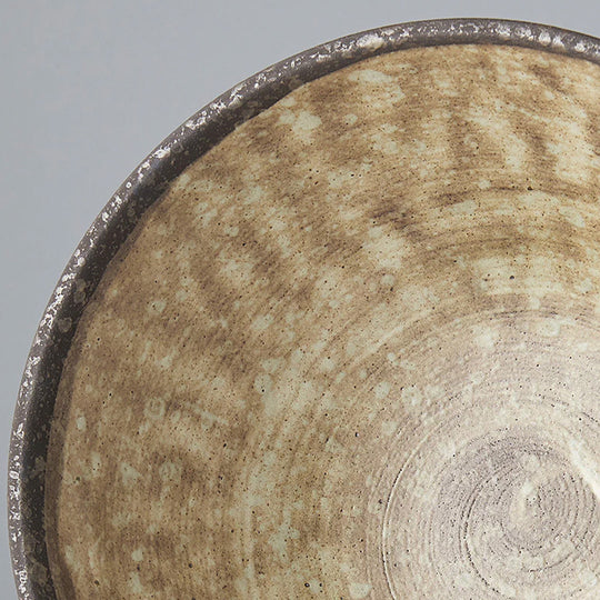 Stunning Udon bowl from Made in Japan with featuring earthy brown glaze with a circular sweep of golden ochre.