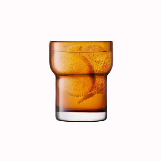 The Amber Utility Tumbler is a modern, step shaped mouth-blown tumbler made from amber coloured glass. Durable and versatile, this tumbler can be used for a variety of drinks including water, beer and short cocktails.