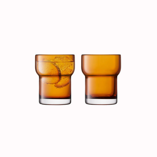A Pair. The Amber Utility Tumbler is a modern, step shaped mouth-blown tumbler made from amber coloured glass. Durable and versatile, this tumbler can be used for a variety of drinks including water, beer and short cocktails.