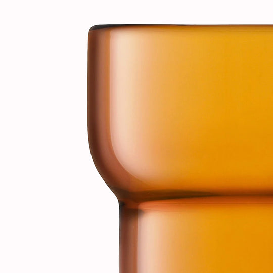 Detail. The Amber Utility Tumbler is a modern, step shaped mouth-blown tumbler made from amber coloured glass. Durable and versatile, this tumbler can be used for a variety of drinks including water, beer and short cocktails.