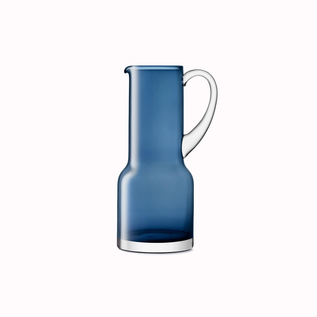 The Utility Jug is a modern, step shaped mouth-blown table jug made from Sapphire Blue coloured glass by LSA International. 