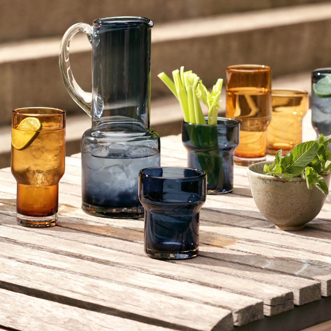 The Utility Jug is a modern, step shaped mouth-blown table jug made from Sapphire Blue coloured glass by LSA International. 