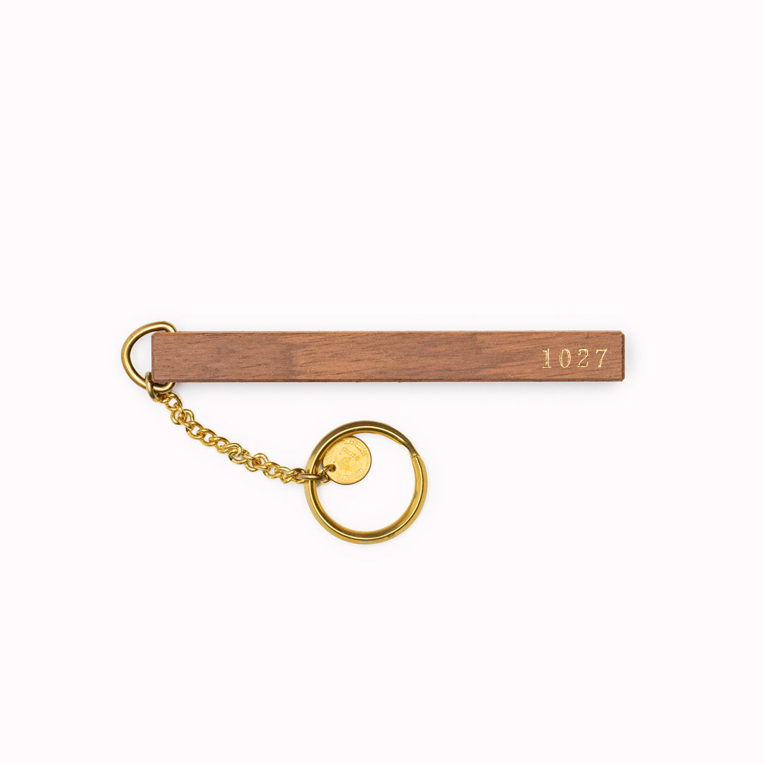 Wooden Hotel Room Keyring, numbered 1027, is a testament to the skilled artisans of Japan.