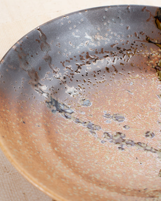 Shallow noodle bowl featuring a rustic glaze with striking green splash. Diameter 225mm and height approx 50mm.