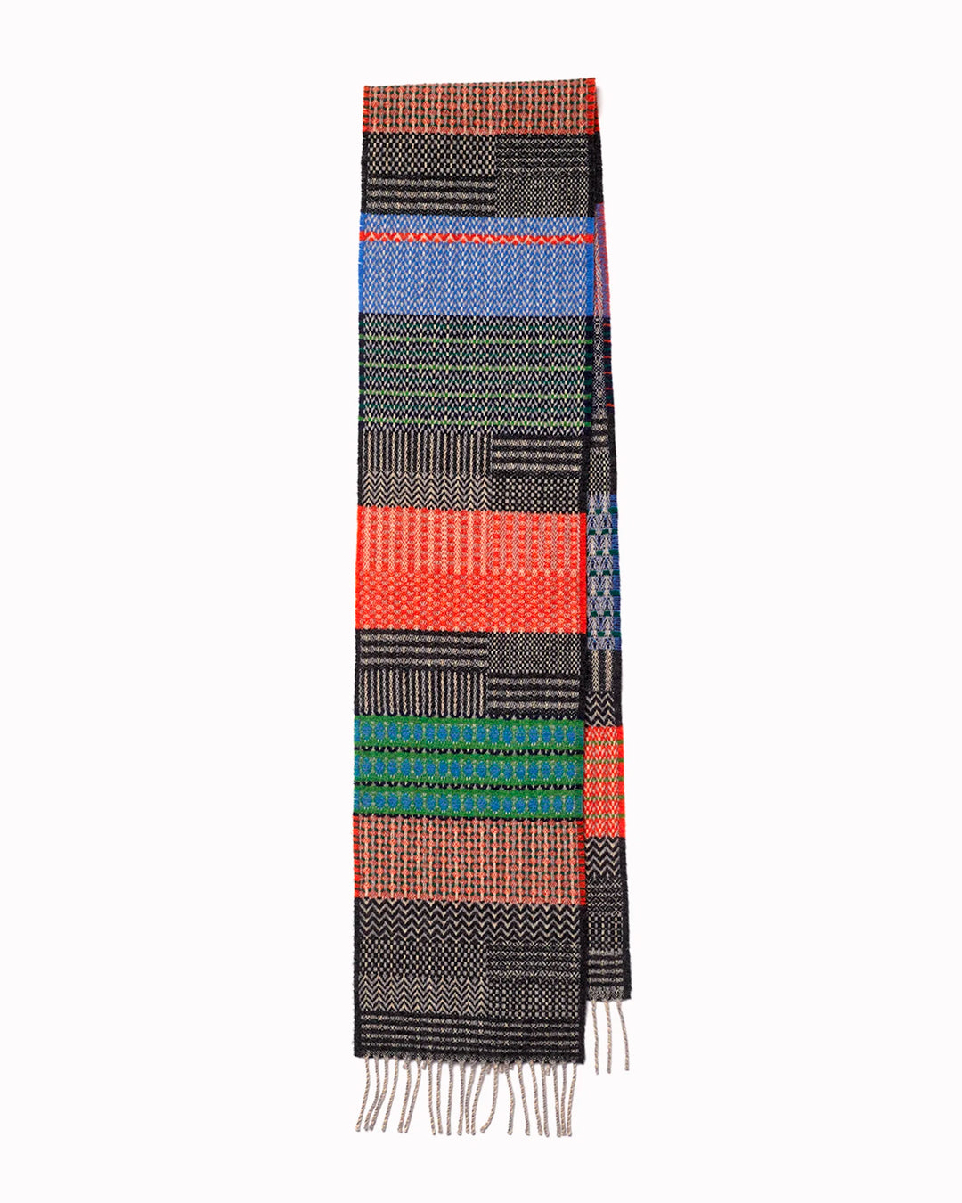 The Walton scarf is an artful mixture of textures and pattern, where graphic dots, dashes, and zigzags interplay. This is all emphasised by colour and contrast.
