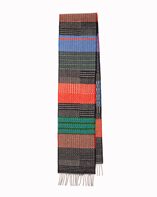 The Walton scarf is an artful mixture of textures and pattern, where graphic dots, dashes, and zigzags interplay. This is all emphasised by colour and contrast.