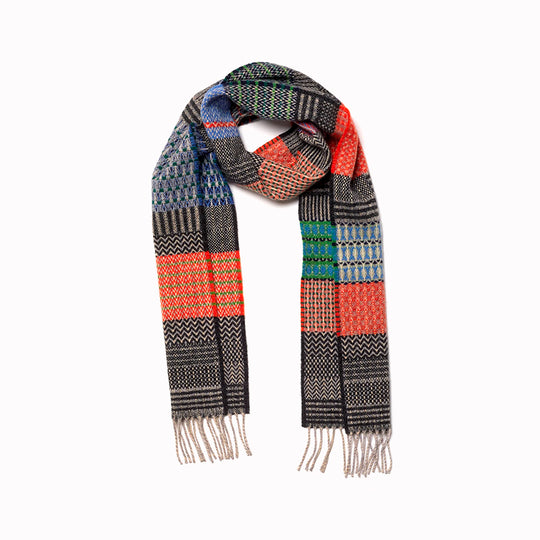 The Walton scarf is an artful mixture of textures and pattern, where graphic dots, dashes, and zigzags interplay. This is all emphasised by colour and contrast.