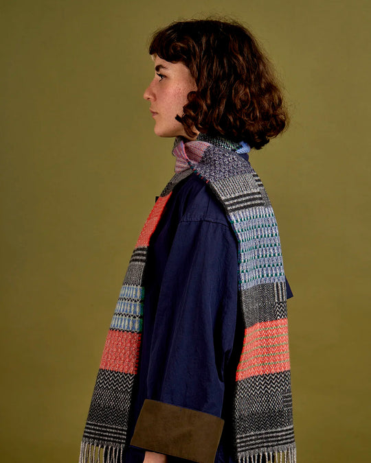 The Walton scarf is an artful mixture of textures and pattern, where graphic dots, dashes, and zigzags interplay. This is all emphasised by colour and contrast.