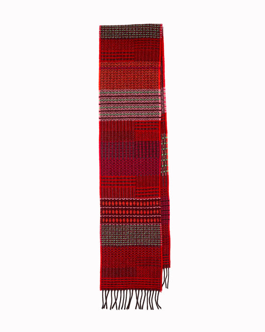 The Walton scarf is an artful mixture of textures and pattern, where graphic dots, dashes, and zigzags interplay. This is all emphasised by colour and contrast.