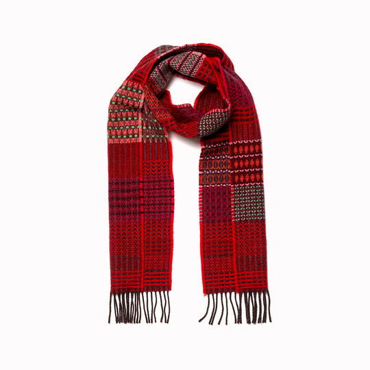 The Walton scarf is an artful mixture of textures and pattern, where graphic dots, dashes, and zigzags interplay. This is all emphasised by colour and contrast.