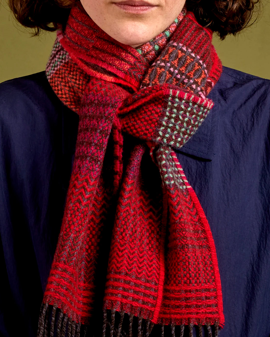 The Walton scarf is an artful mixture of textures and pattern, where graphic dots, dashes, and zigzags interplay. This is all emphasised by colour and contrast.