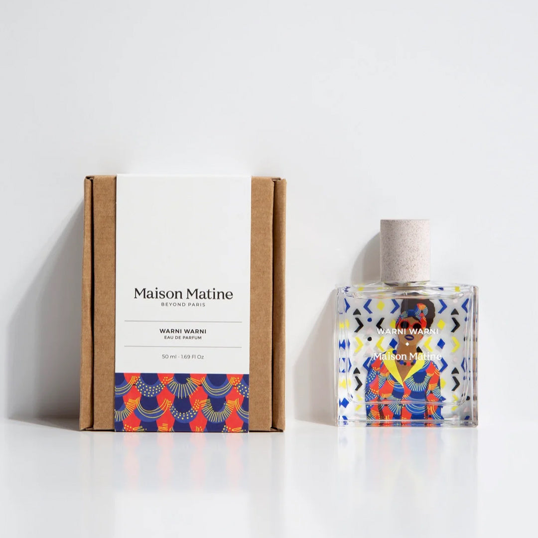 Maison Matine's 'Warni Warni' is a scent inspired by a sharing, welcoming diversity and cultural mixing, all housed in an illustrative glass bottle. The name means 'come to me' which is an invitation to share in Arabic. Patterned 50ml bottle with woman in sunglasses, with box.