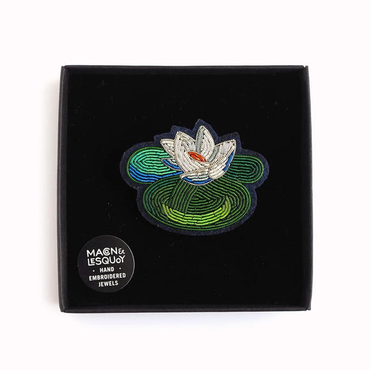 Hand-embroidered Water Lily lapel pin by Parisian fashion accessory brand Macon et Lesquoy.
