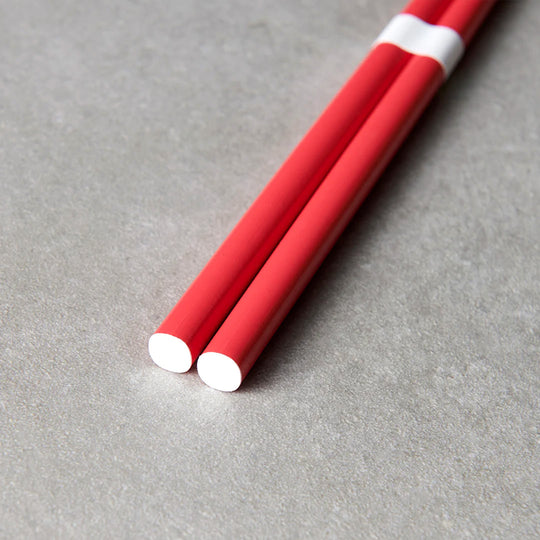 Watermelon Red lacquerware finish with white accent chopsticks from Made in Japan. This Chopstick collection is designed and made at the Zumi workshop in Fukui prefecture, Japan.