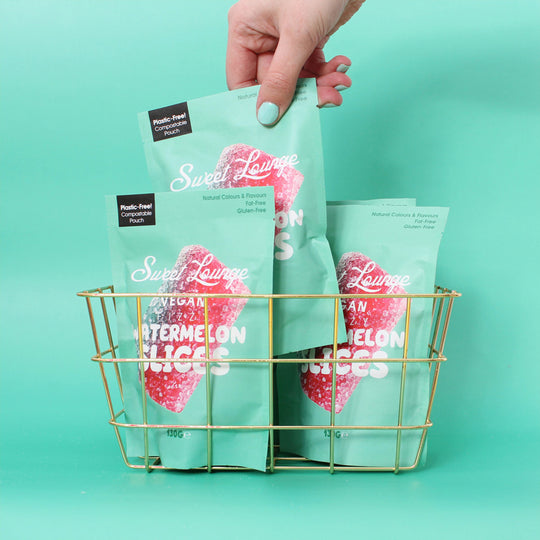Sweet Lounge Vegan Fizzy Watermelon Slices are playful, bite-sized gummies shaped like watermelon wedges, delivering a tart fizzy zing alongside natural fruit sweetness