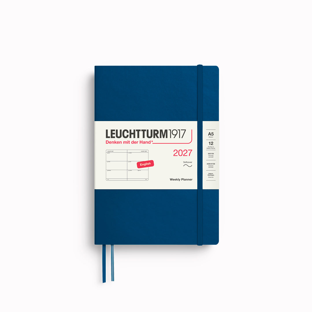 This A5 softcover yearly planner showcases 12 months of weekly layouts, including phases of the moon and international holidays.