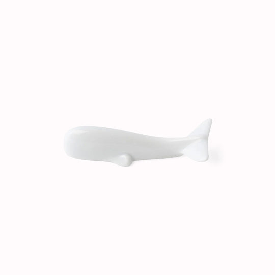 A pure white porcelain whale chopstick rest. 8.5cm x 3cm 1.5cm height Made of 'Minoyaki' porcelain, fired at a high temperature and hand finished in Gifu prefecture, Japan.