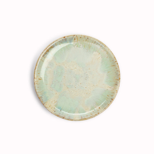 The Whispy Mint Crystal Moon Plate from Studio Arhoj is hand thrown and hand glazed in Copenhagen