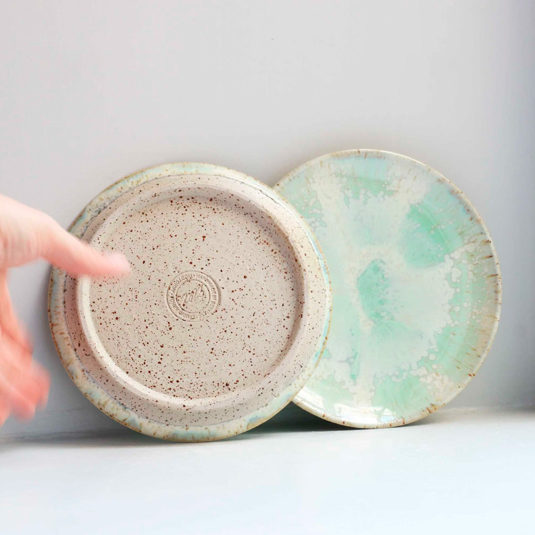 The Whispy Mint Crystal Moon Plate from Studio Arhoj is hand thrown and hand glazed in Copenhagen