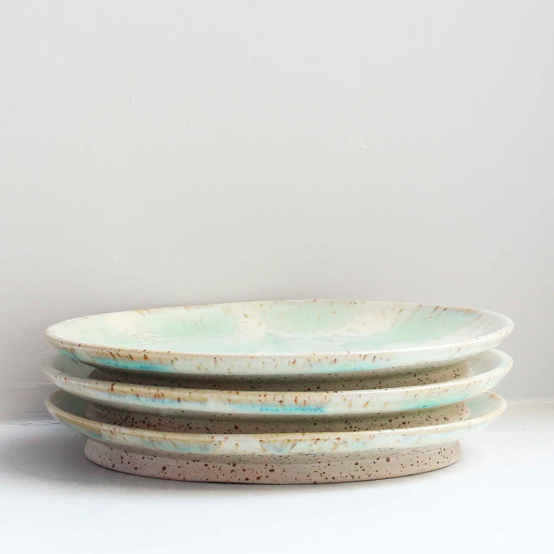 The Whispy Mint Crystal Moon Plate from Studio Arhoj is hand thrown and hand glazed in Copenhagen