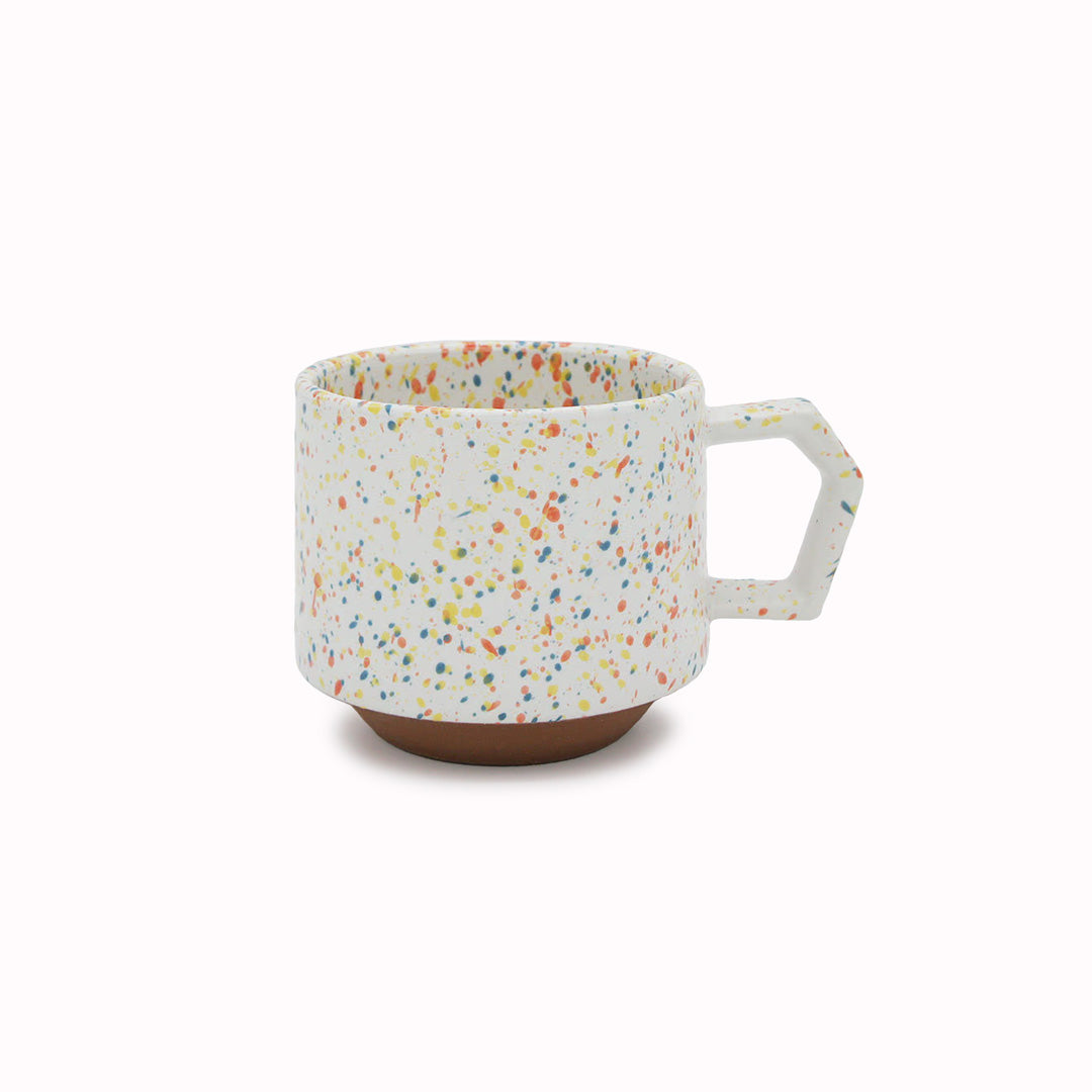 Compact and Easy to hold and stackable for easy storage. This Splash mug has a mixture of orange, yellow, and blue onto a white base with an unglazed base. They are sturdy and comfortable to hold with a unique silhouette.