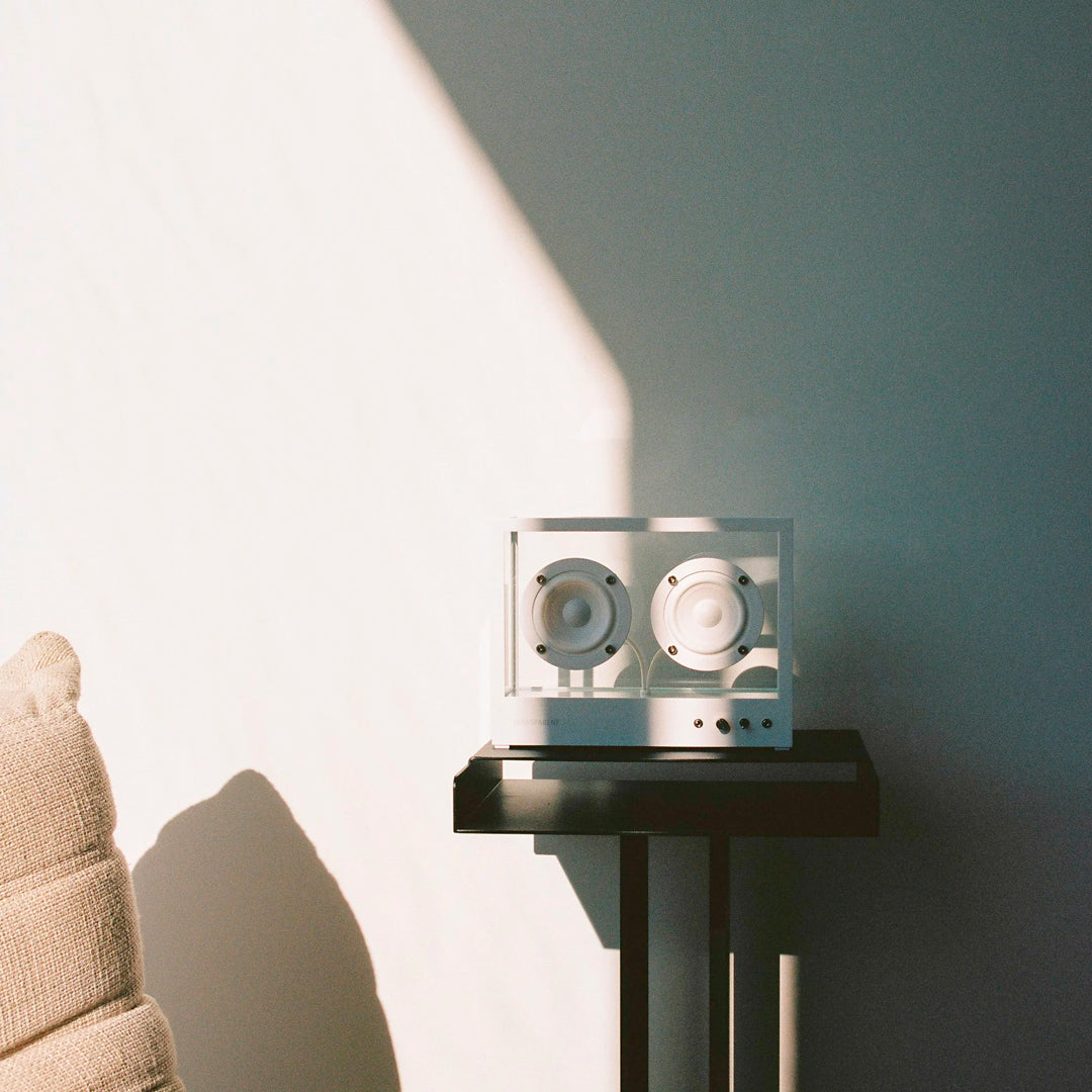 The Transparent Small Transparent Speaker in white is a compact Bluetooth speaker built with the same thinking as good furniture — minimal, functional and made to last.