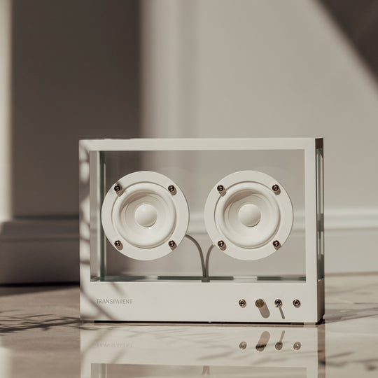 The Transparent Small Transparent Speaker in white is a compact Bluetooth speaker built with the same thinking as good furniture — minimal, functional and made to last.