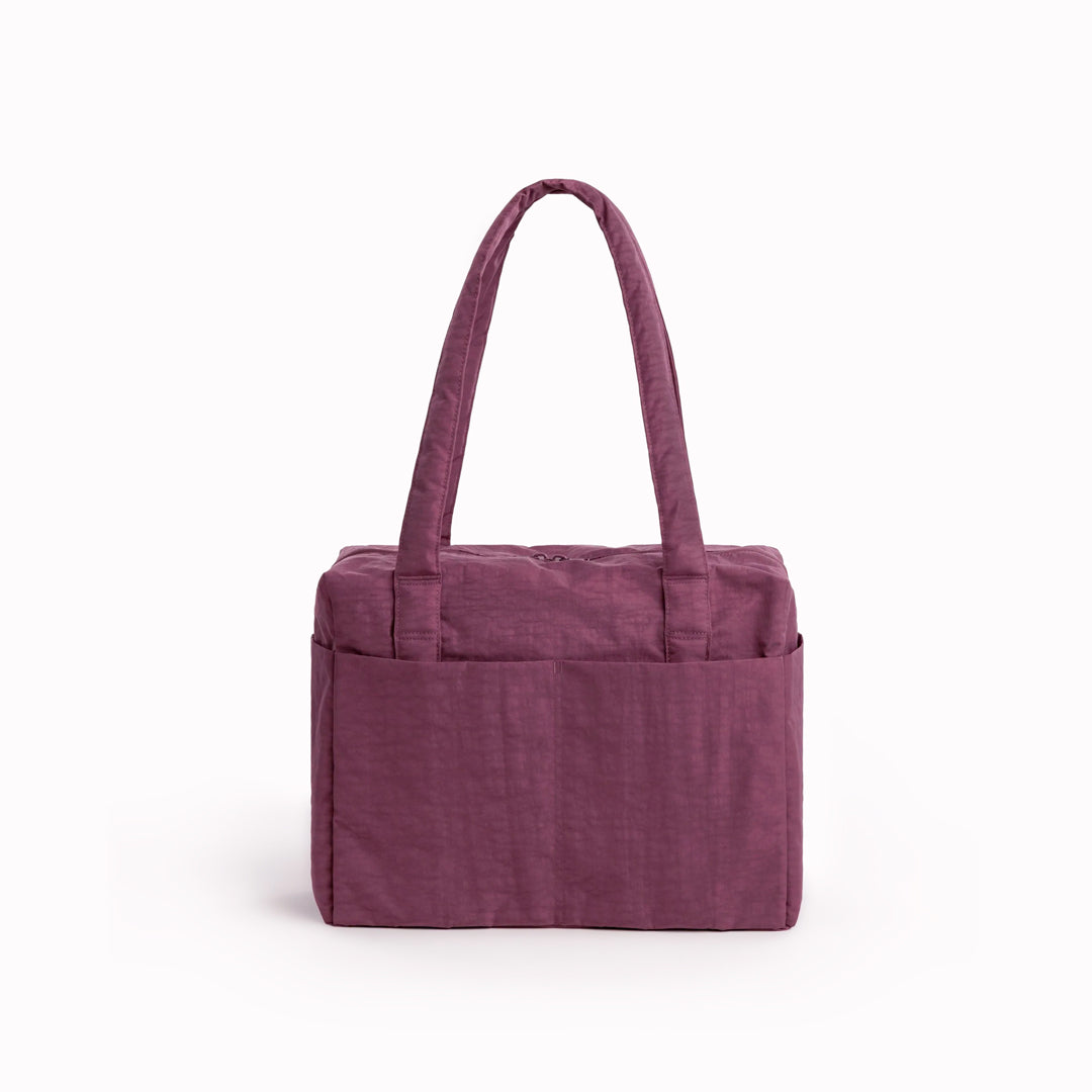 A compact carry-on built around movement. This scaled-down version of BAGGU’s Cloud series keeps the same soft structure, but tightens the proportions for under-seat travel and everyday carry.