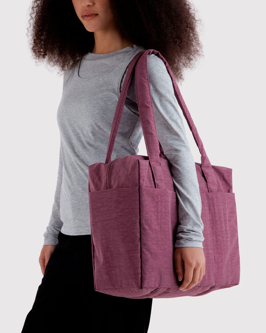 A compact carry-on built around movement. This scaled-down version of BAGGU’s Cloud series keeps the same soft structure, but tightens the proportions for under-seat travel and everyday carry.