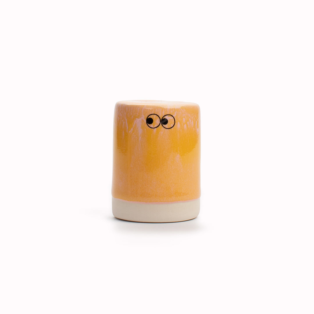 Meet Buto! A hand glazed ceramic figurine created as a close relative of the classic Arhoj Ghost. The Familia, including Buto, is a continuation of the playful decorative object series from Studio Arhoj.