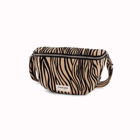 The Custine Belt Bag in Zebra Print is a stylish and practical accessory crafted from upcycled fabric. Designed by Rive Droite, a brand known for its commitment to sustainable fashion
