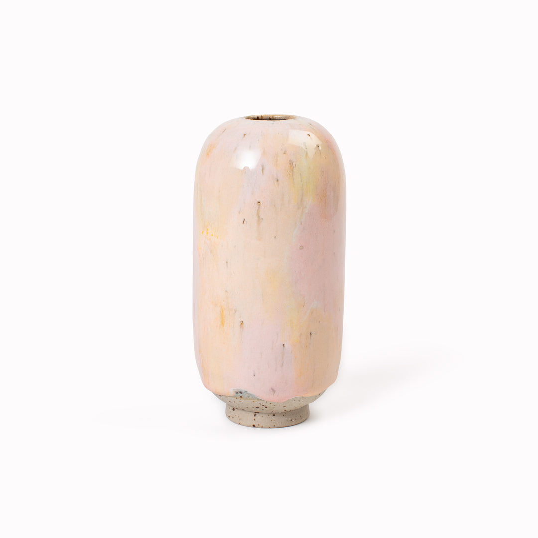 The Zephyr Mini Yuki Vase&nbsp;design is hand-thrown in watertight stoneware. Due to the rounded taper at the top of the vase, the glaze melts down the sides of the cylindrical vase mimicking melting ice.&nbsp;