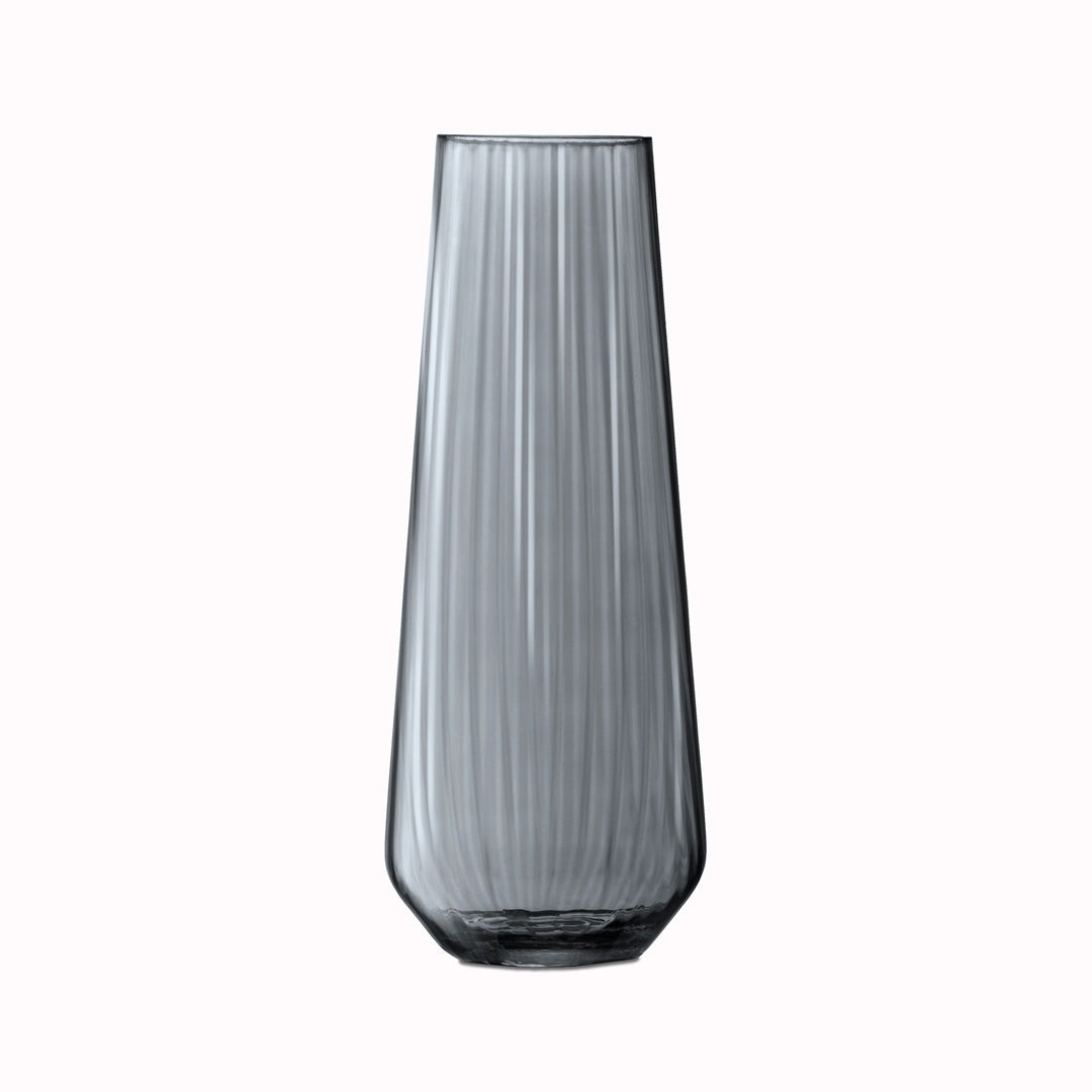 The Zinc Vase is a tall teardrop shaped vase made from mouth blown glass and has a pleated texture with a hand painted lustre finish. The pleated texture enhances the grey colouration that is inspired by the colour of zinc.
