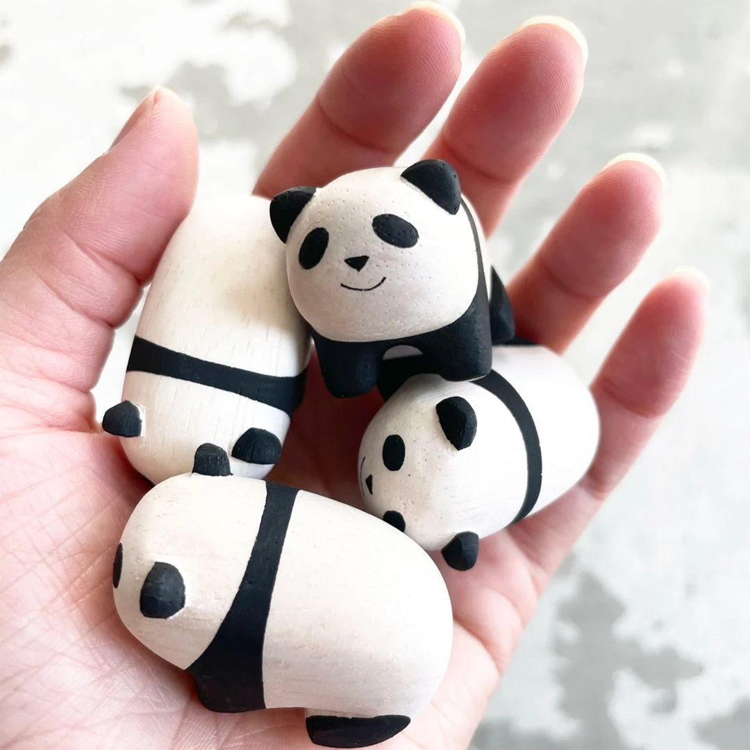 Handmade wooden Baby Panda detail from the Pole Pole collection in hand by Japanese brand T-Lab.